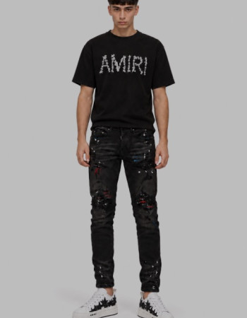 AMIRI Aged Black Paint Splatter MX1 Jeans.