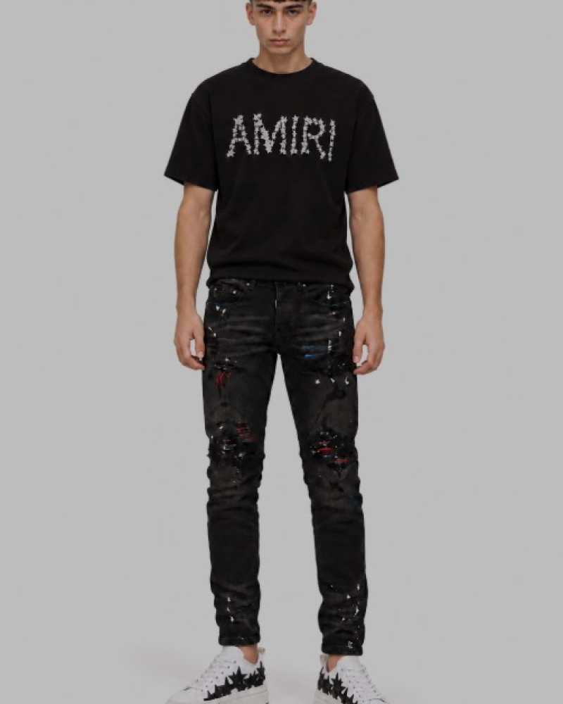 AMIRI Aged Black Paint Splatter MX1 Jeans.