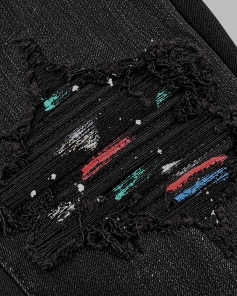AMIRI Aged Black Paint Splatter MX1 Jeans.