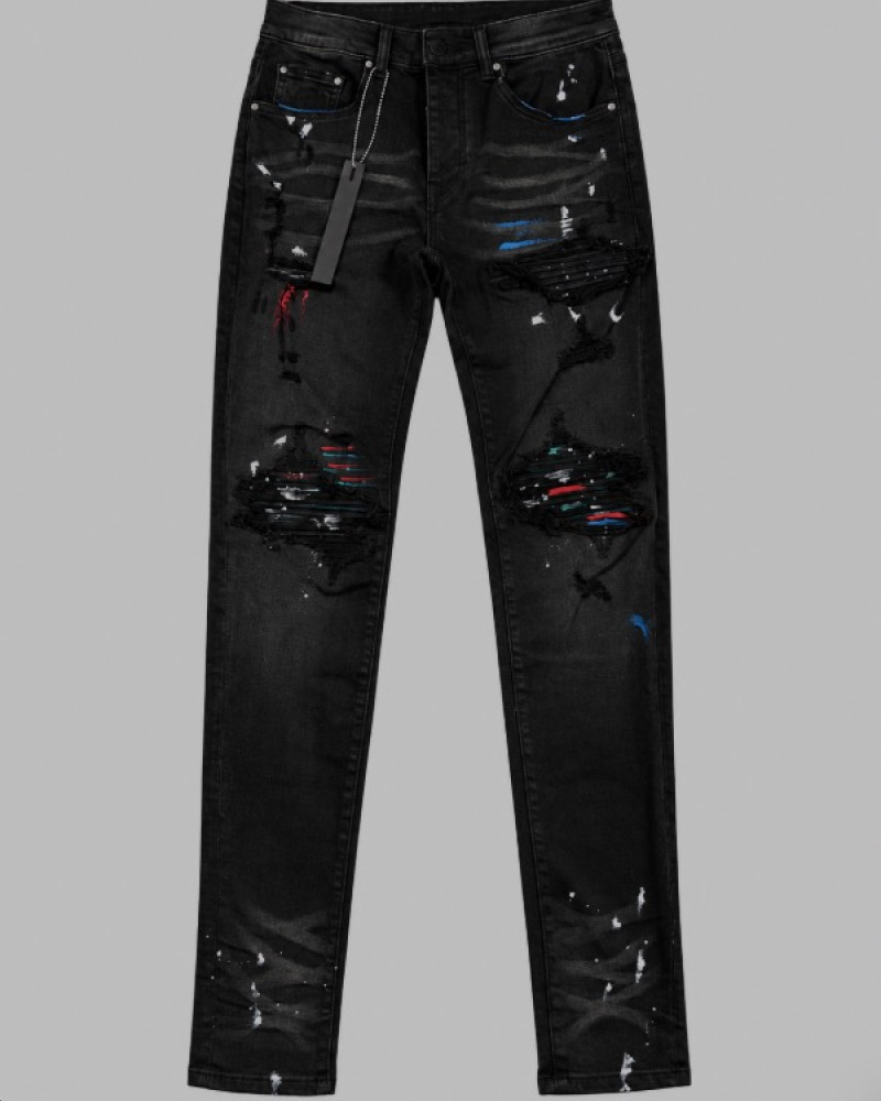 AMIRI Aged Black Paint Splatter MX1 Jeans.