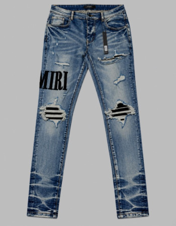 AMIRI Light Indigo & Black Core Appliqué Logo Jeans.