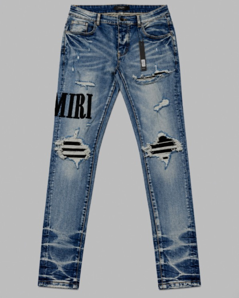 AMIRI Light Indigo & Black Core Appliqué Logo Jeans.