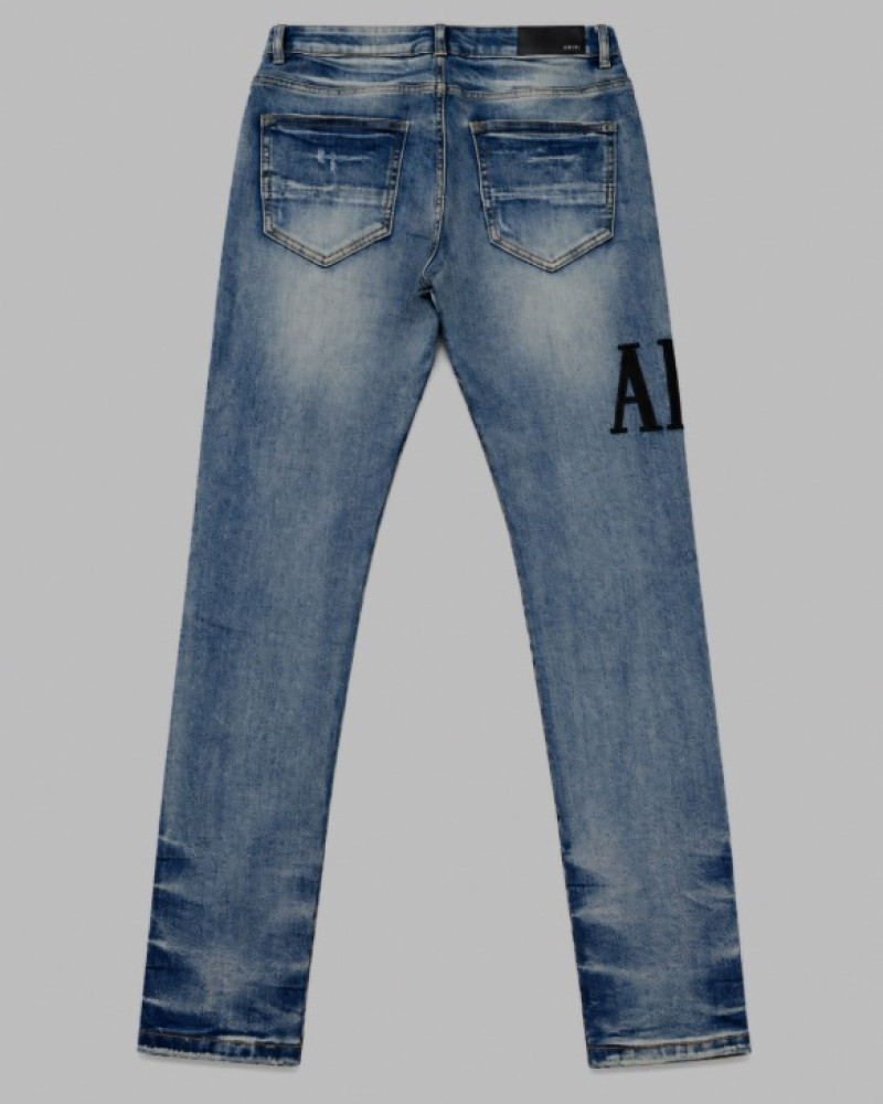 AMIRI Light Indigo & Black Core Appliqué Logo Jeans.