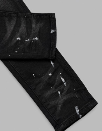 AMIRI Aged Black Paint Splatter MX1 Jeans.