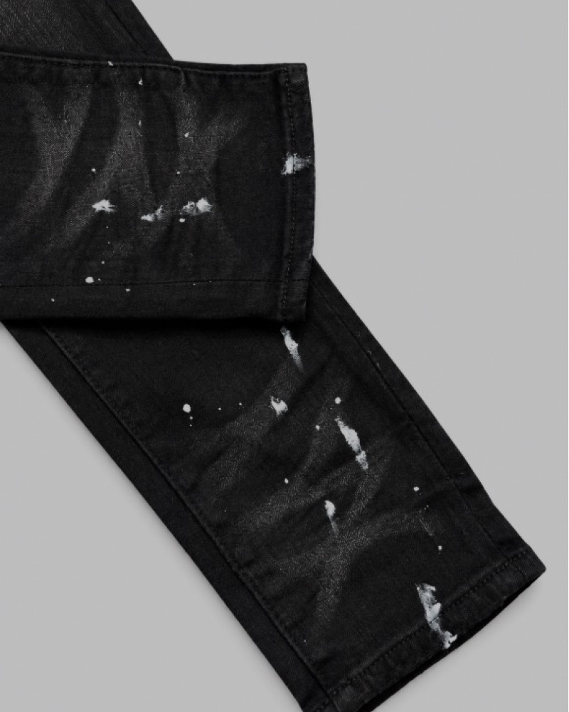 AMIRI Aged Black Paint Splatter MX1 Jeans.
