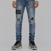 AMIRI Light Indigo & Black Core Appliqué Logo Jeans.