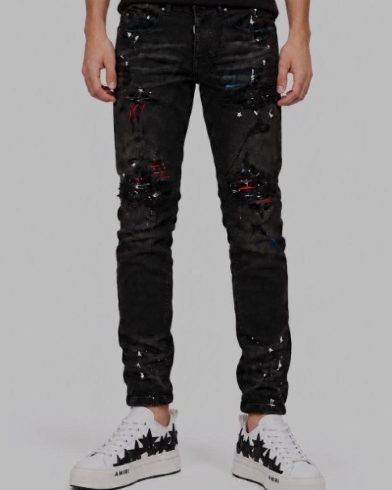 AMIRI Aged Black Paint Splatter MX1 Jeans.