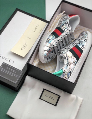 Gucci Ace GG Supreme Holographic Sneakers.