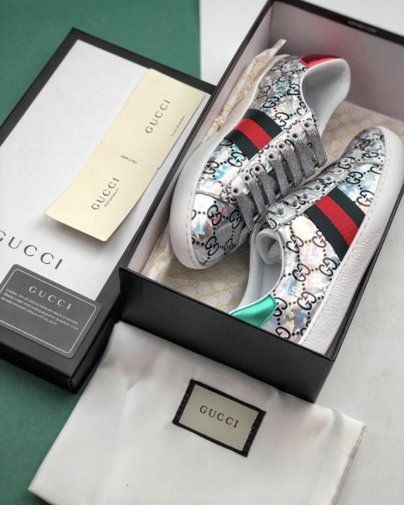 Gucci Ace GG Supreme Holographic Sneakers.